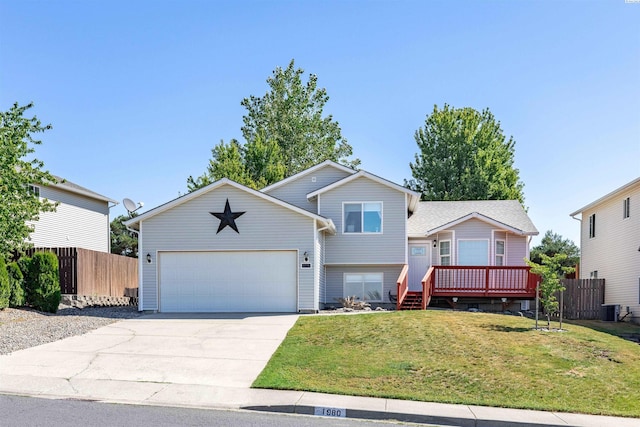 view of front of property with a wooden deck, central AC, and a front lawn