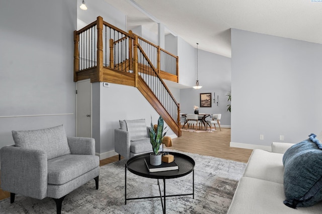 4214 W Klamath Ave Unit B-2, Kennewick, WA 99336 - living room featuring stairway, wood finished floors, baseboards, and high vaulted ceiling
