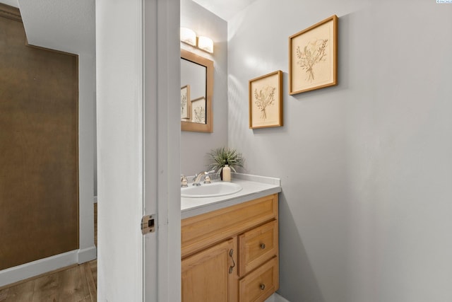 4214 W Klamath Ave Unit B-2, Kennewick, WA 99336 - bathroom featuring vanity, wood finished floors, and baseboards