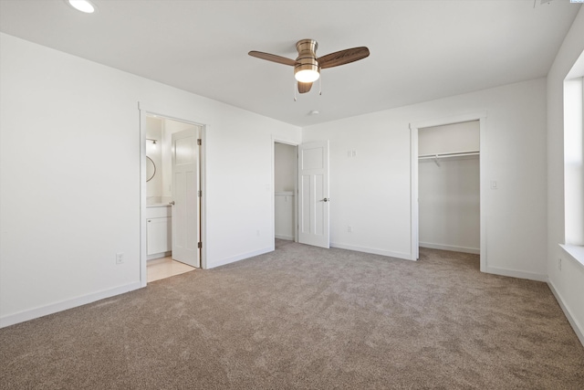 125 Claret Dr, Prosser, WA 99350 - unfurnished bedroom featuring baseboards, ensuite bath, ceiling fan, light carpet, and a closet