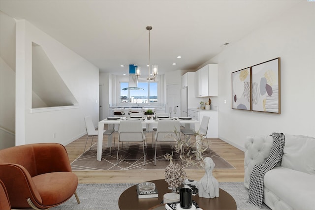 125 Claret Dr, Prosser, WA 99350 - living room featuring baseboards, light wood-style floors, recessed lighting, and a chandelier