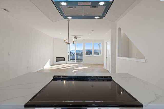125 Claret Dr, Prosser, WA 99350 - kitchen with open floor plan, visible vents, recessed lighting, and light stone counters