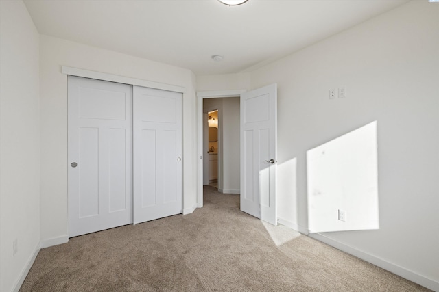 125 Claret Dr, Prosser, WA 99350 - unfurnished bedroom with baseboards, a closet, and carpet flooring