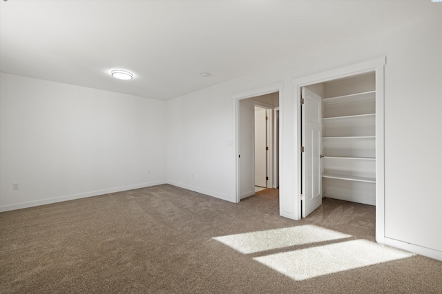 125 Claret Dr, Prosser, WA 99350 - unfurnished bedroom with baseboards, carpet floors, and a walk in closet