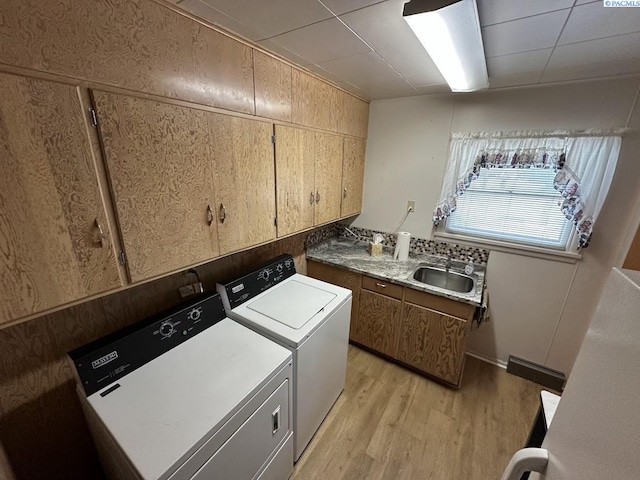 404 D St, Endicott, WA 99125 - laundry room featuring separate washer and dryer, cabinet space, and light wood-style floors