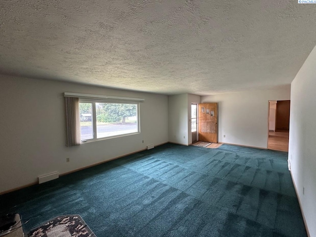 404 D St, Endicott, WA 99125 - carpeted spare room featuring a textured ceiling and baseboards