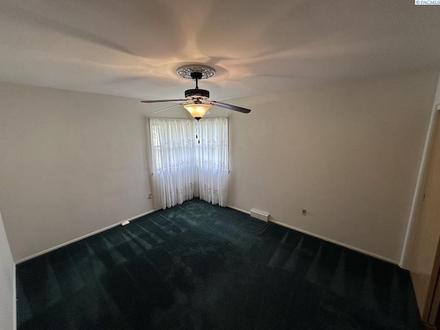 404 D St, Endicott, WA 99125 - unfurnished room featuring ceiling fan and dark carpet