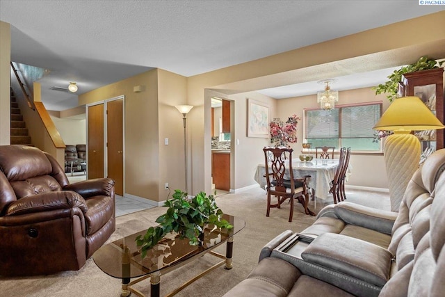 5001 E Killdeer Ct, West Richland, WA 99353 - living area with light carpet, a chandelier, stairway, and baseboards