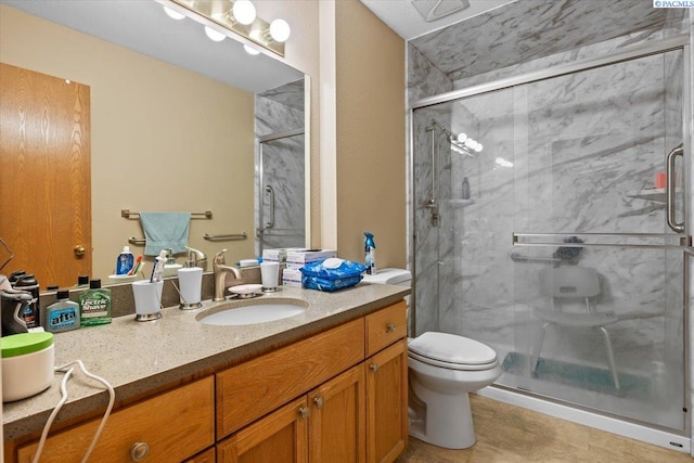 5001 E Killdeer Ct, West Richland, WA 99353 - bathroom featuring vanity, a marble finish shower, and toilet