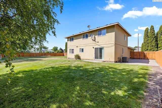 5001 E Killdeer Ct, West Richland, WA 99353 - rear view of house with central air condition unit and a patio