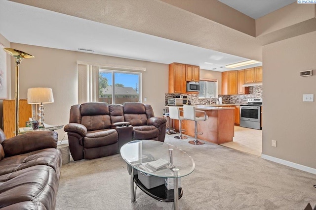 5001 E Killdeer Ct, West Richland, WA 99353 - living area featuring light carpet and baseboards