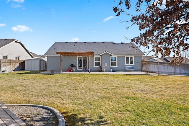 rear view of house with a patio, a pergola, a yard, and a storage unit