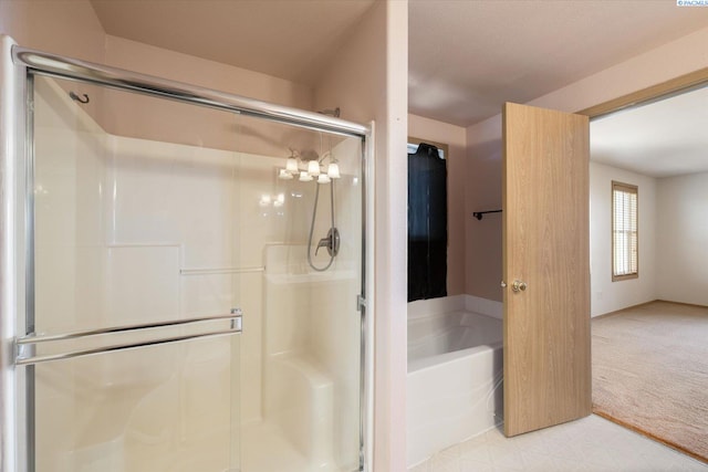 full bath with a garden tub, a shower stall, and tile patterned floors