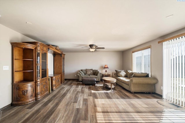 living room with ceiling fan and wood finished floors