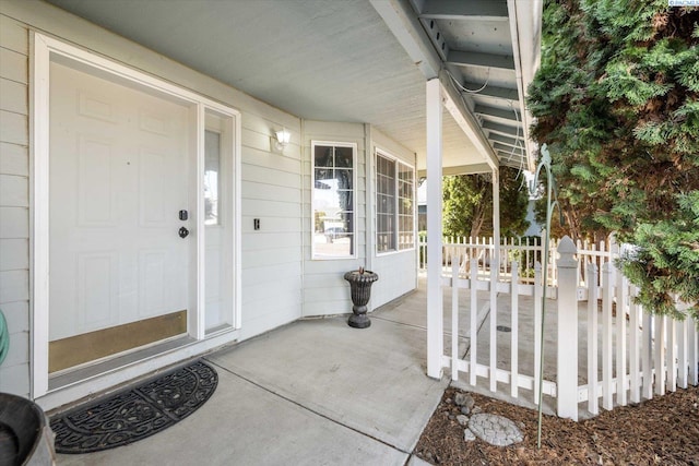 doorway to property featuring covered porch