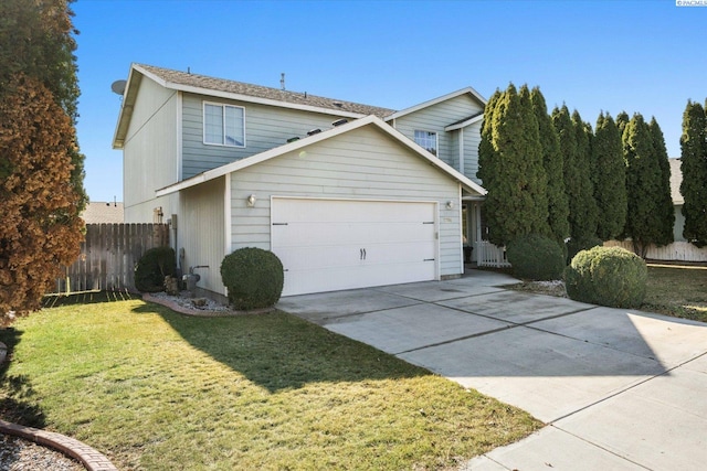 view of front facade featuring a garage, fence, driveway, and a front lawn