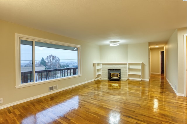 unfurnished living room featuring wood-type flooring