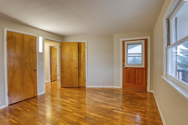 foyer featuring a healthy amount of sunlight and light wood-type flooring