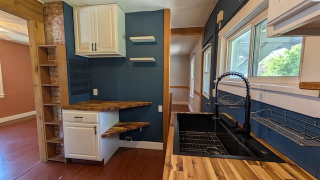 535 SE Side St, Pullman, WA 99163 - kitchen featuring wood counters, baseboards, dark wood-type flooring, open shelves, and a sink