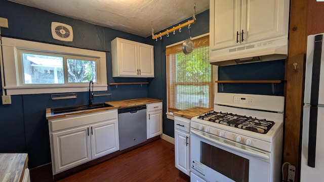 535 SE Side St, Pullman, WA 99163 - kitchen featuring white appliances, under cabinet range hood, wood counters, a sink, and white cabinetry