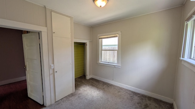535 SE Side St, Pullman, WA 99163 - unfurnished bedroom with multiple windows, a closet, baseboards, and crown molding