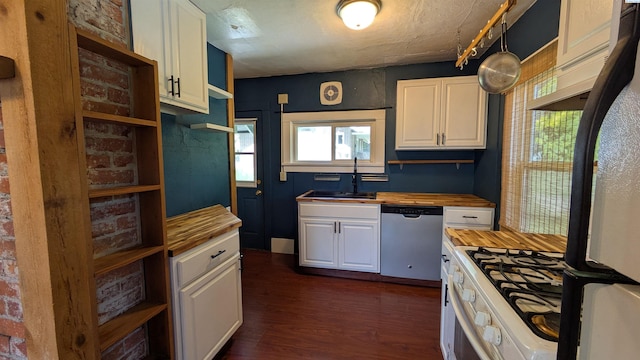 535 SE Side St, Pullman, WA 99163 - kitchen featuring stainless steel dishwasher, wooden counters, a sink, and freestanding refrigerator