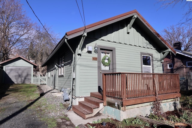 535 SE Side St, Pullman, WA 99163 - rear view of house featuring board and batten siding, fence, and a wooden deck