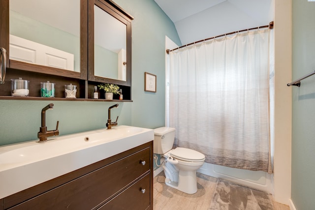 full bathroom with shower / tub combo, vanity, and toilet