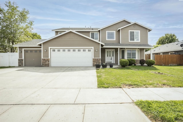 view of front facade featuring a garage and a front lawn