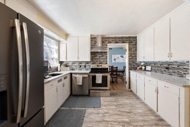 1907 Howell Ave, Richland, WA 99353 - kitchen featuring backsplash, a sink, appliances with stainless steel finishes, and wall chimney exhaust hood