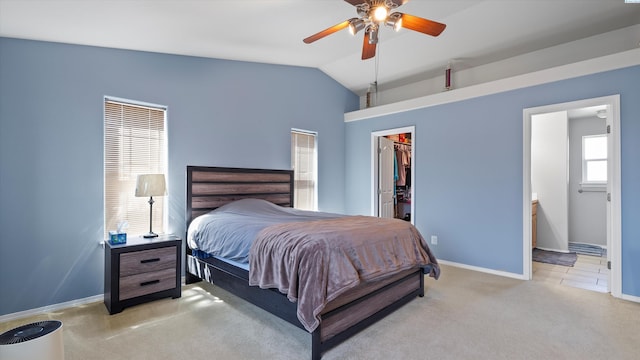 9907 Chelan Ct, Pasco, WA 99301 - carpeted bedroom with lofted ceiling, a spacious closet, a closet, ensuite bathroom, and ceiling fan