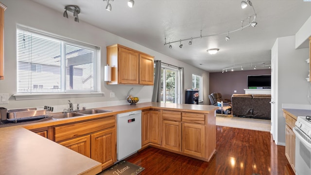 9907 Chelan Ct, Pasco, WA 99301 - kitchen featuring rail lighting, white appliances, a peninsula, dark wood-type flooring, and open floor plan