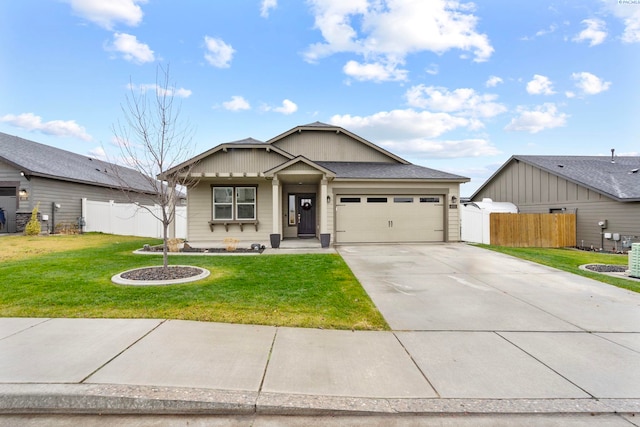 view of front of property featuring a garage and a front yard