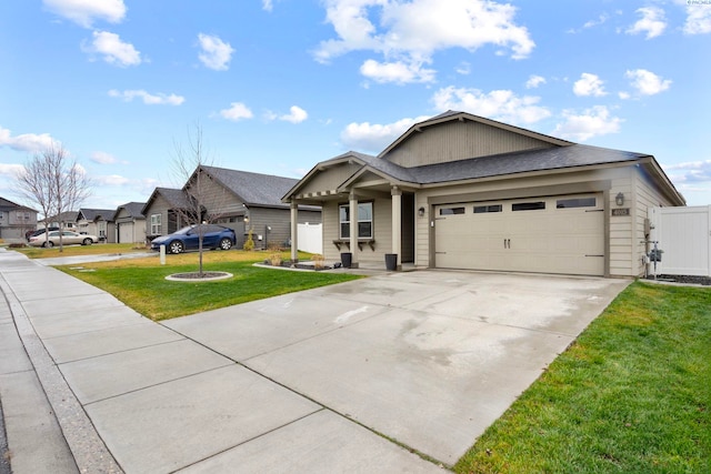 view of front of property with a garage and a front lawn