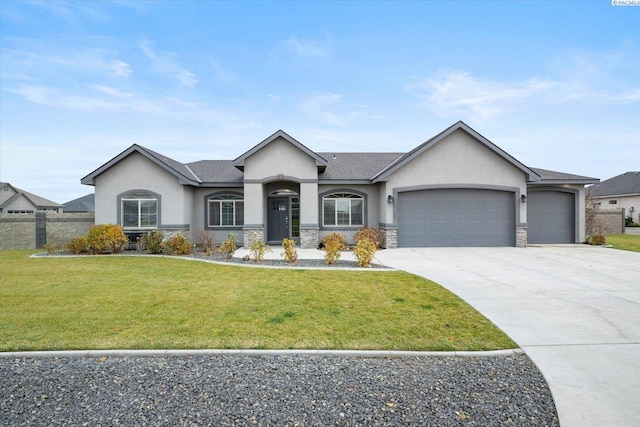 view of front of home with a garage and a front lawn