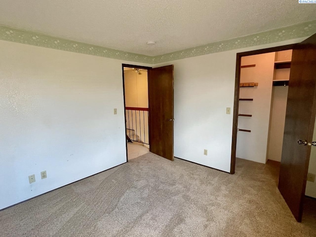 2120 Duportail St Unit 1, Richland, WA 99352 - unfurnished bedroom with carpet flooring and a textured ceiling