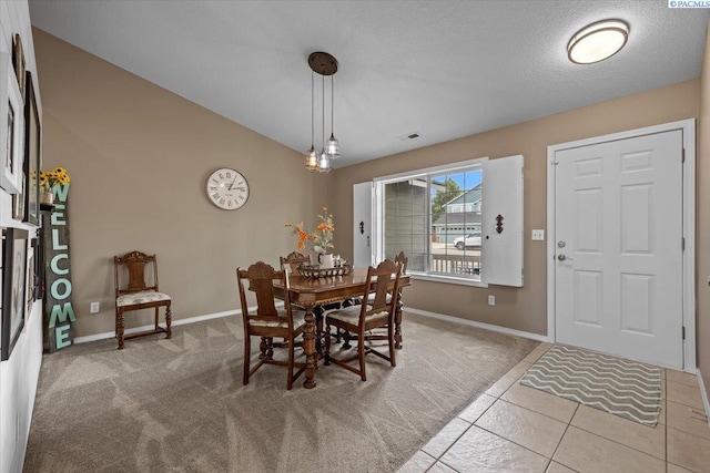 8602 W 1st Ave, Kennewick, WA 99336 - carpeted dining space featuring baseboards and tile patterned floors