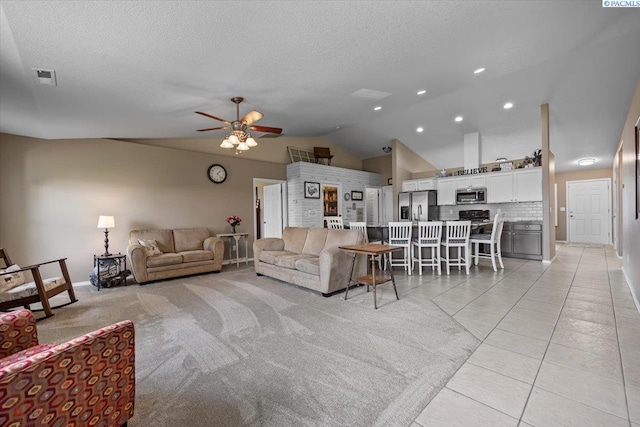 8602 W 1st Ave, Kennewick, WA 99336 - living room with vaulted ceiling, a ceiling fan, a textured ceiling, baseboards, and recessed lighting