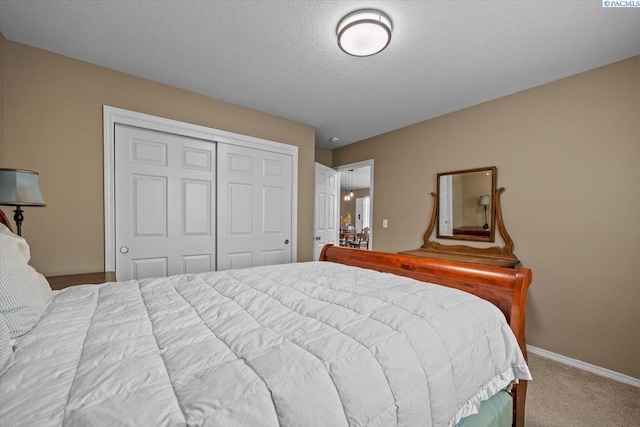 8602 W 1st Ave, Kennewick, WA 99336 - bedroom with a closet, carpet floors, a textured ceiling, and baseboards