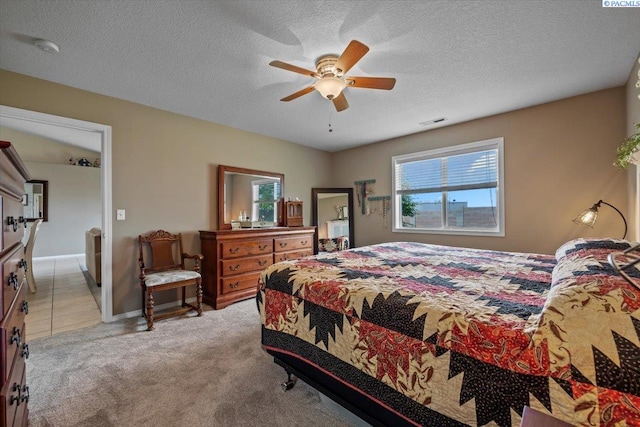 8602 W 1st Ave, Kennewick, WA 99336 - bedroom featuring light carpet, a ceiling fan, baseboards, and a textured ceiling