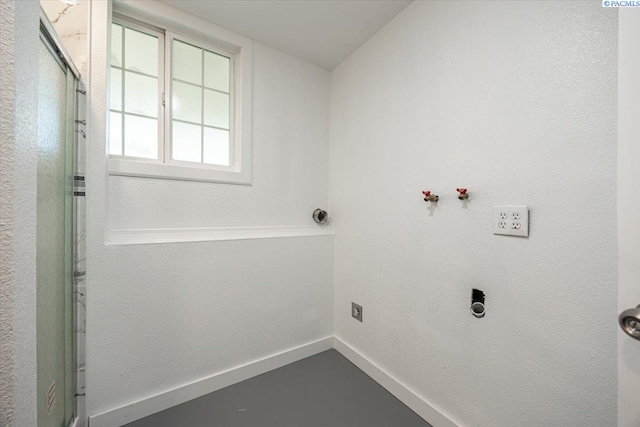 laundry area featuring electric dryer hookup and washer hookup