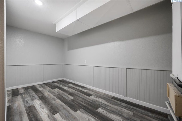 unfurnished room featuring dark hardwood / wood-style flooring