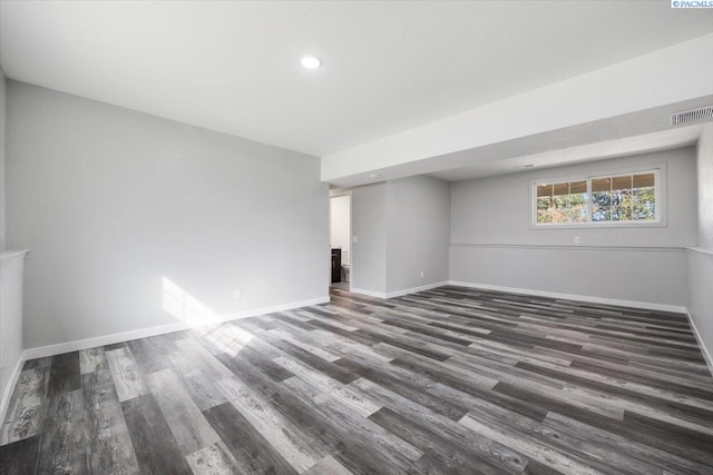 unfurnished room with dark hardwood / wood-style floors