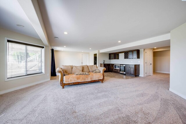 1105 SW Meyer Dr, Pullman, WA 99163 - living room featuring wet bar, light carpet, recessed lighting, and beverage cooler