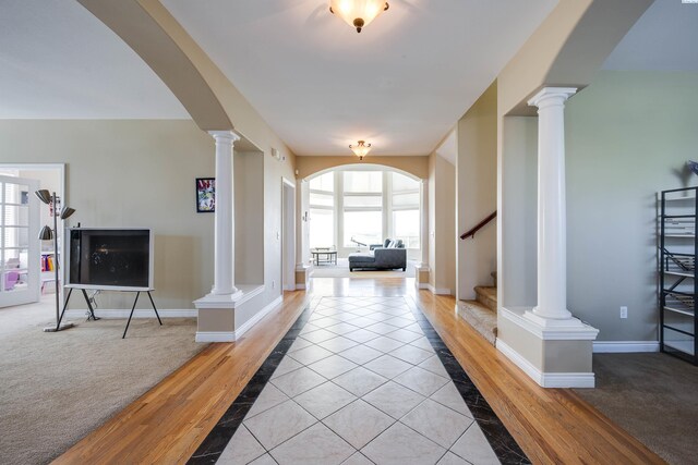 1105 SW Meyer Dr, Pullman, WA 99163 - corridor with arched walkways, light wood-style floors, ornate columns, and stairway