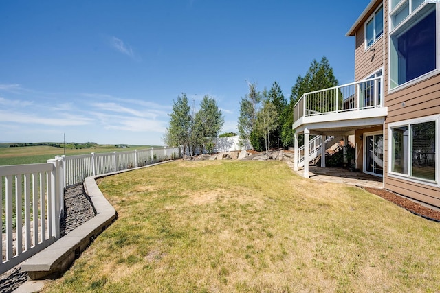 1105 SW Meyer Dr, Pullman, WA 99163 - fenced backyard with a wooden deck and stairway