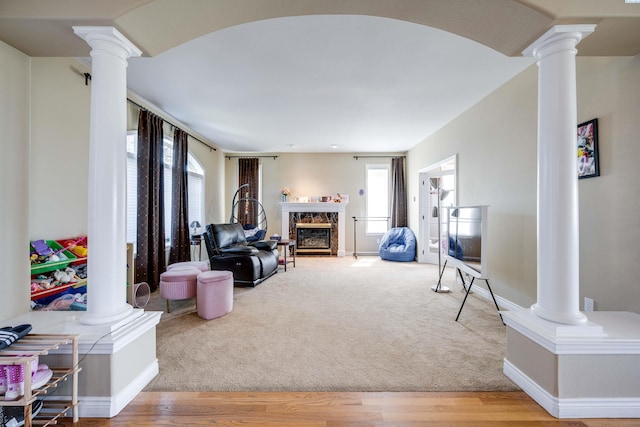 1105 SW Meyer Dr, Pullman, WA 99163 - living room with decorative columns, a fireplace, and light wood finished floors