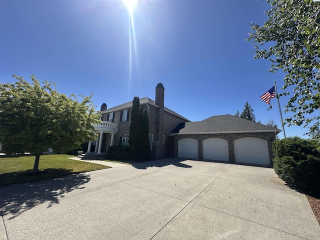 1105 SW Meyer Dr, Pullman, WA 99163 - view of front facade featuring driveway, a garage, and a front lawn