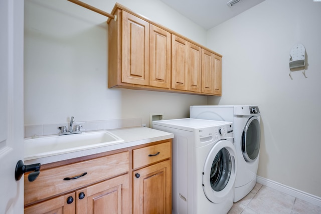 1105 SW Meyer Dr, Pullman, WA 99163 - laundry room featuring cabinet space, independent washer and dryer, and light tile patterned floors