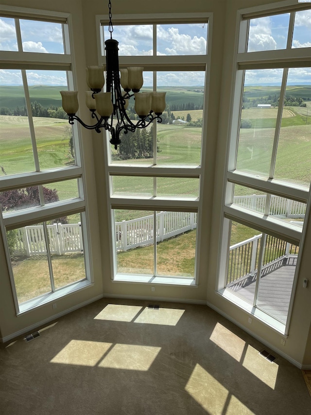 1105 SW Meyer Dr, Pullman, WA 99163 - unfurnished sunroom featuring a chandelier and plenty of natural light